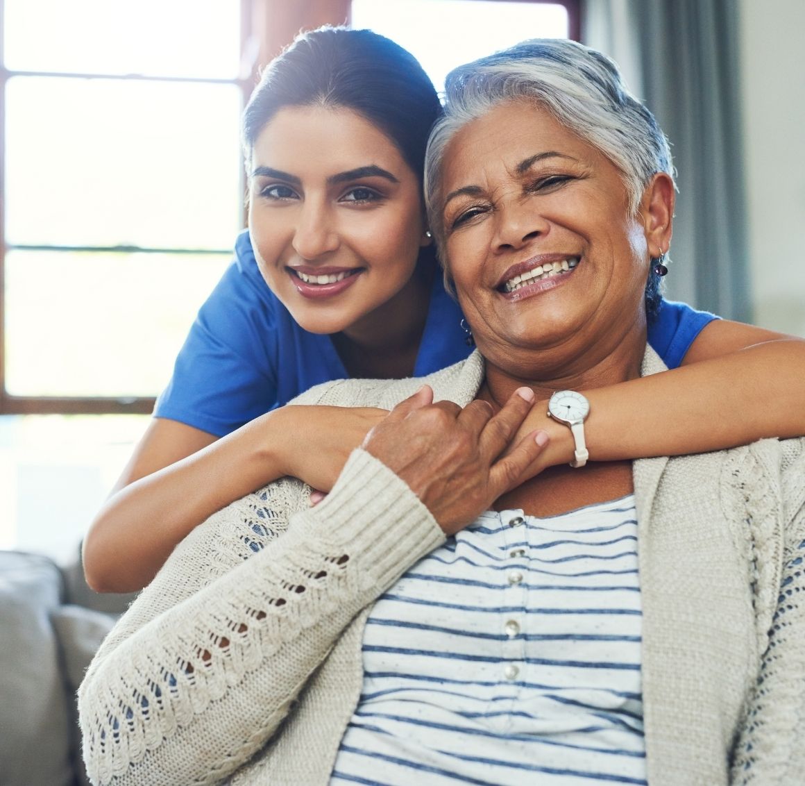 caregiver-hugging-elderly